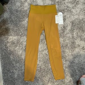 EUC Vuori women’s Rib Studio Legging - Dark Golden